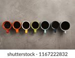 Flat lay composition with cups of coffee on gray background. Food photography