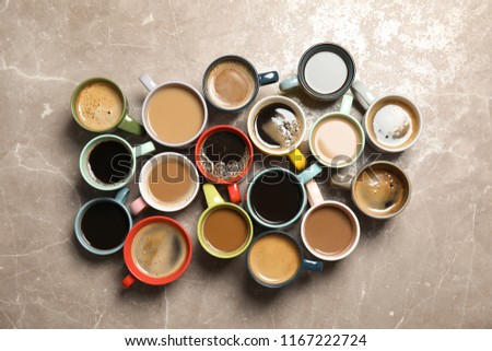 Flat lay composition with cups of coffee on gray background. Food photography