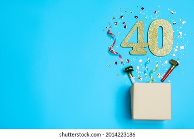 Flat lay composition with decor and numbers on light blue background, space for text. 40th birthday party