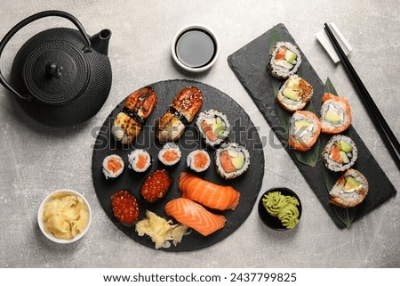 Similar – Image, Stock Photo Delicious sushi rolls on board with chopsticks