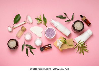 Flat lay composition with different body care products on pink background