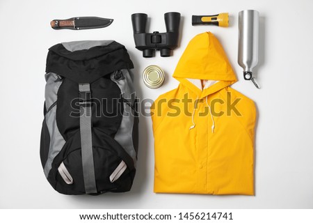 Flat lay composition with different camping equipment on white background