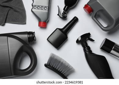 Flat lay composition with different car wash products on white background