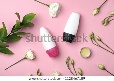Flat lay composition with different deodorants on color background
