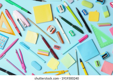 Flat lay composition with different school stationery on light blue background. Back to school - Shutterstock ID 1919300240