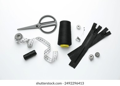 Flat lay composition with different sewing supplies on white background - Powered by Shutterstock