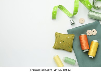 Flat lay composition with different sewing supplies on white background. Space for text - Powered by Shutterstock