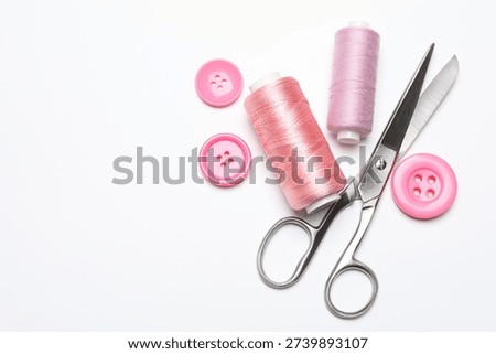 Flat lay composition with different sewing supplies on white background, space for text