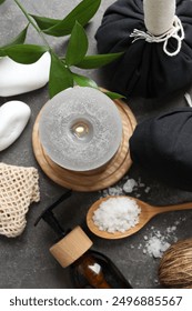 Flat lay composition with different spa products on grey textured table
