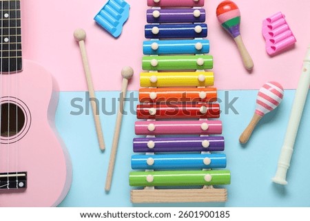 Flat lay composition with different toy musical instruments on color background