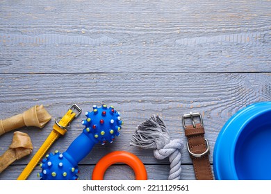 Flat Lay Composition With Dog Collar And Different Accessories On Grey Wooden Table, Space For Text