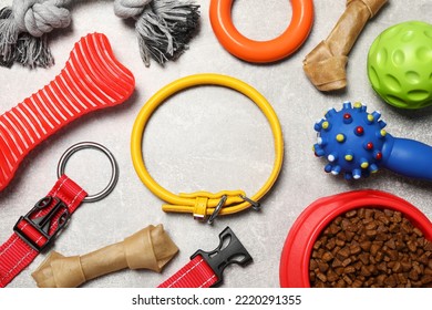 Flat Lay Composition With Dog Collar, Toys And Food On Grey Background