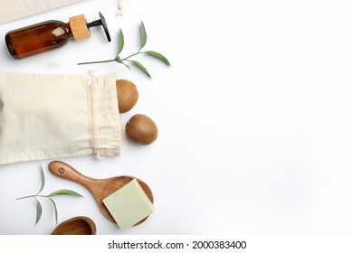 Flat lay composition with eco friendly products on white background, space for text