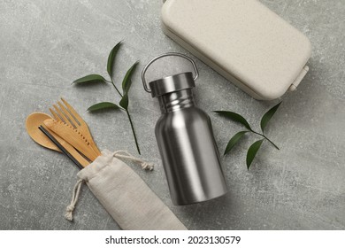 Flat Lay Composition With Eco Friendly Products On Grey Background. Conscious Consumption