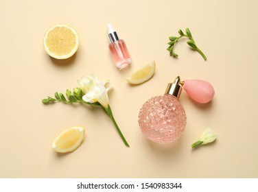 Flat lay composition with elegant perfume on beige background