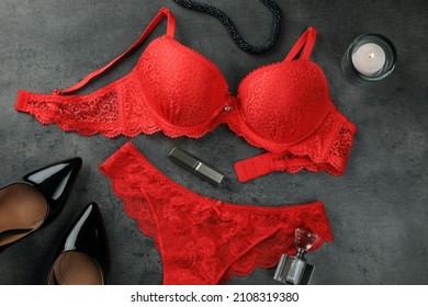 Flat lay composition with elegant red women's underwear on grey background