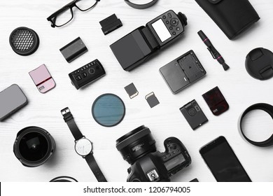 Flat lay composition with equipment for professional photographer on wooden background - Shutterstock ID 1206794005