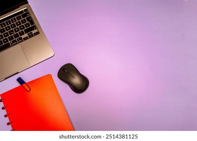 A flat lay composition featuring a red notebook, fountain pen, laptop, and mouse on a desk, representing modern workspace essentials for productivity and organization. Text space available. - Powered by Shutterstock