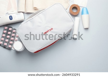 Flat lay composition with first aid kit on gray background