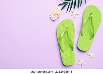 Flat lay composition with flip flops and seashell on colored background. Space for text top view. - Powered by Shutterstock