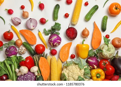 Flat lay composition with fresh vegetables on white background