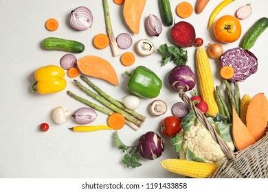 Flat lay composition with fresh vegetables on light background - Shutterstock ID 1191433858