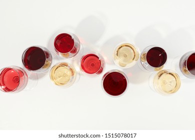 Flat Lay Composition. Glasses With Different Wine On White Background, Top View