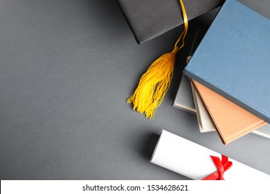 Flat lay composition with graduation hat and student's diploma on grey background, space for text - Powered by Shutterstock