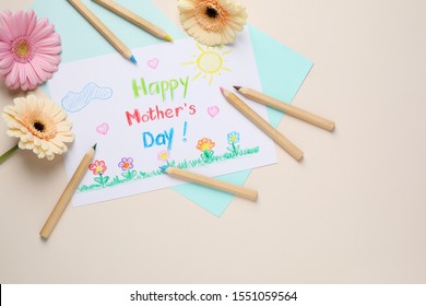 Flat lay composition with handmade greeting card for Mother's Day on beige background