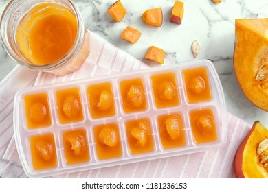 Flat Lay Composition With Ice Cube Tray Of Baby Food On Marble Background