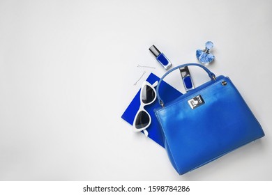 Flat lay composition inspired by color of the year 2020  (Classic blue) on white background