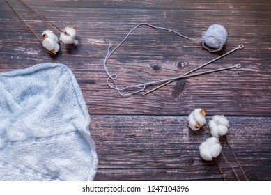 Flat lay composition. Knitting, cotton flower and wool.