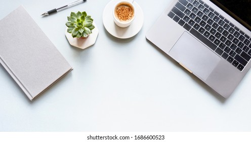 Flat Lay Composition With Laptop, Pen, Coffee, Notebook On Grey Background Banner. Concept Remote Study And Work At Home, Telework, Freelance, Quarantine. Distance Online Learning. Copyspace. Banner