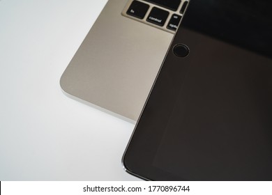 Flat lay composition with laptop and tablet on white background. Home office
