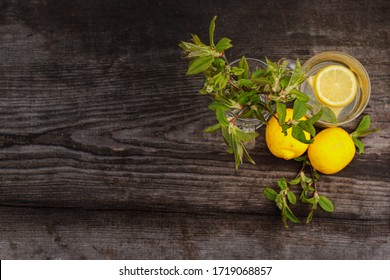 Flat Lay Composition of lemons and leaves on a wooden table