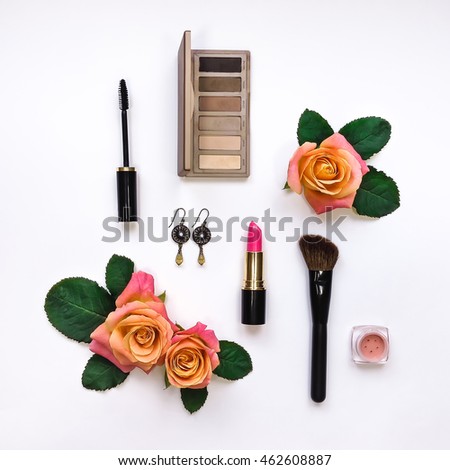 Flat lay composition with make up and essential accessories for woman. Top view, view from above on white background