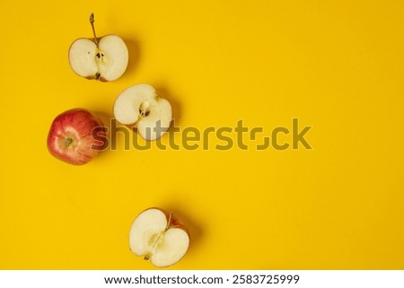 Flat lay composition with many red apples on yellow background. Space for text. High quality photo