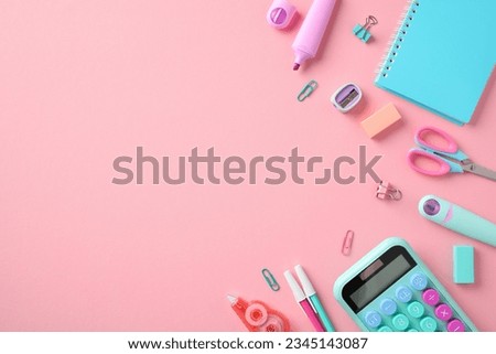 Flat lay composition with modern school supplies on pastel pink background. Back to school, education concept.