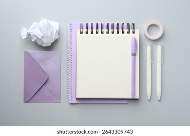 Flat lay composition with notebook on gray background