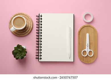 Flat lay composition with notebook on pink background