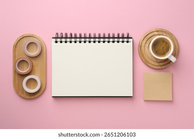 Flat lay composition with notebook on pink background