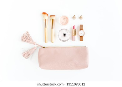 Flat Lay Composition With Pink Cosmetic Bag With Cosmetic Makeup Products, Isolated On White Background. Flat Lay, Top View.