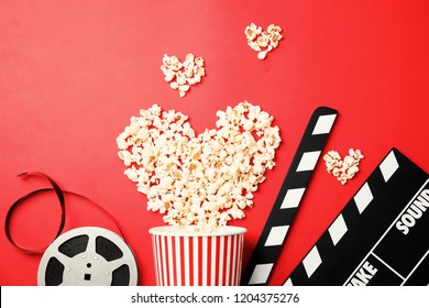 Flat lay composition with popcorn on color background. Cinema snack