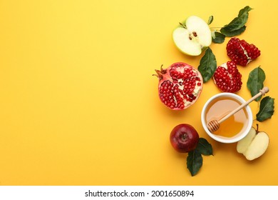 Flat lay composition with Rosh Hashanah holiday attributes on yellow background. Space for text - Shutterstock ID 2001650894