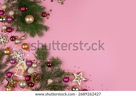 Flat lay composition with serpentine streamers and Christmas decor on pink background. Space for text