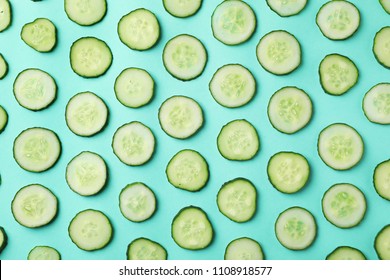 Flat lay composition with slices of cucumber on color background - Shutterstock ID 1108918577