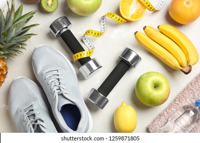 Flat Lay Composition With Sport Items And Healthy Food On Grey Background. Weight Loss Concept