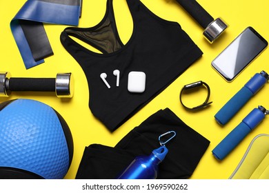 Flat Lay Composition With Sports Equipment On Yellow Background