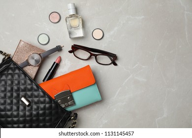 Flat lay composition with stylish bag, wallet and accessories on light background