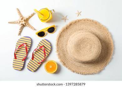 Flat lay composition with summer vacation accessories on white background,top view. Happy holidays - Powered by Shutterstock